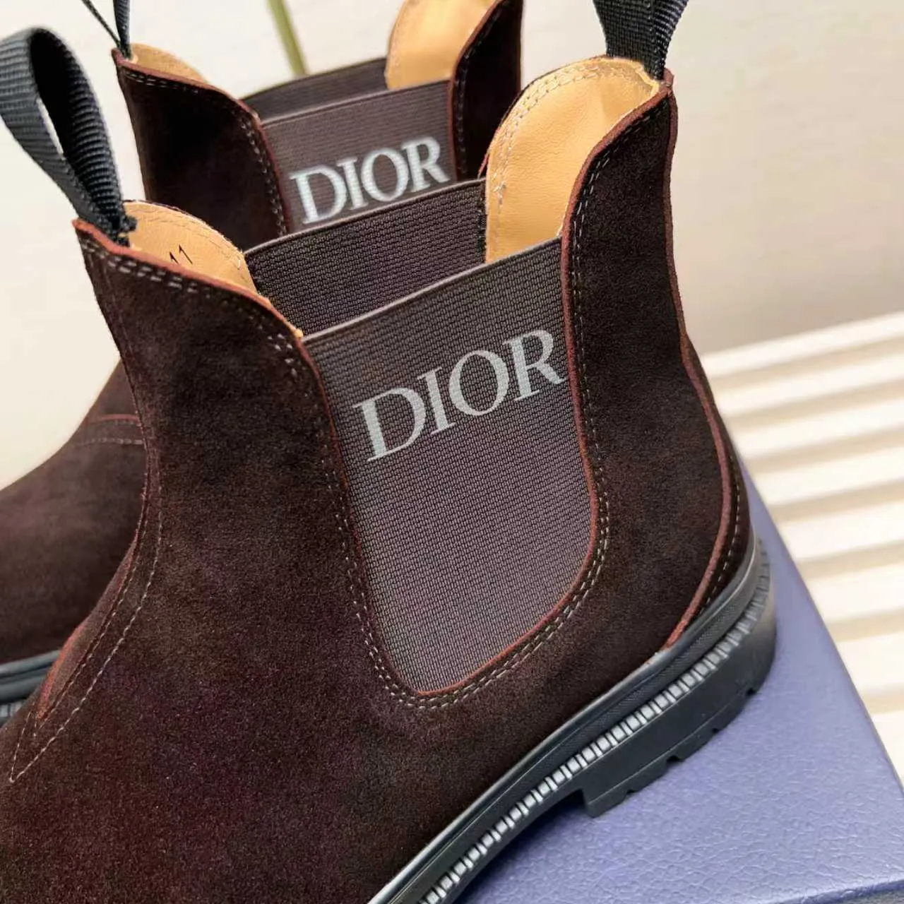 Men's Shoes 💰480 Dior A practical choice that combines protection with classic style. Made from durable Rugged Calf leather, it's tumbled and hand-finished to create a soft suede feel with a rich texture. Elastic side panels and subtle cutouts are inspired by the classic Chelsea boot. Leather upper and lining with Kummel tabs at front and rear, rubber outsole